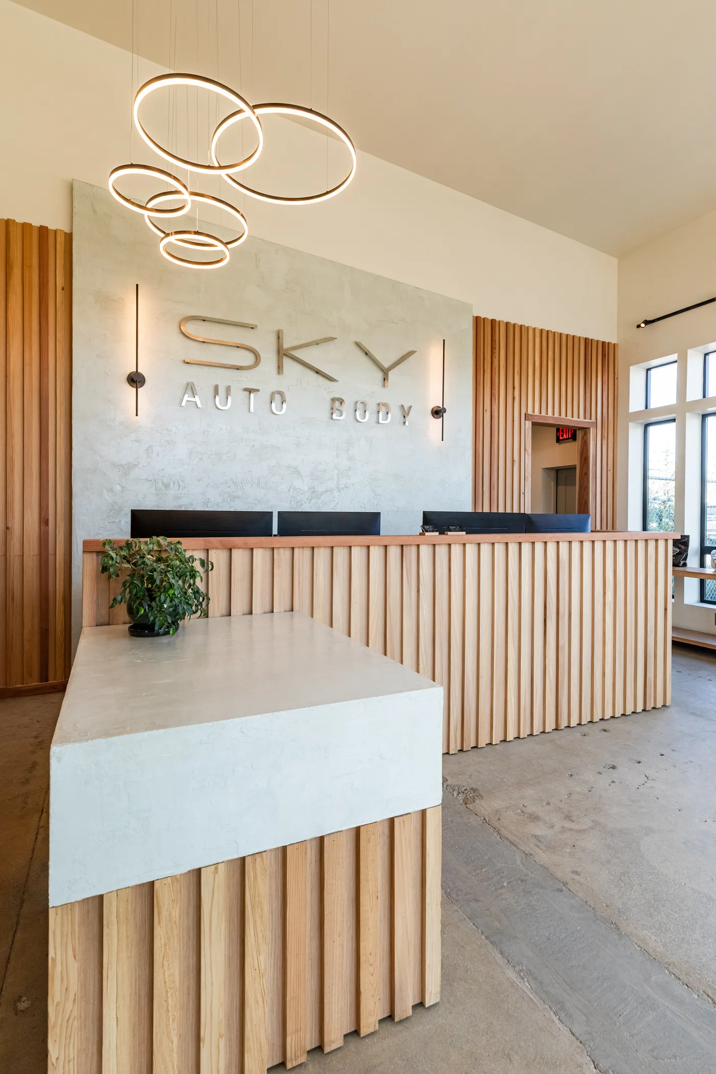 Front desk and customer lounge inside Sky Auto Body in Medford